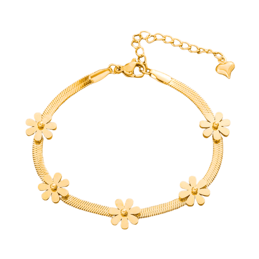 Gold bracelet with floral designs on a white background