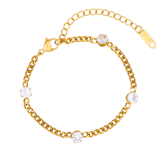 Gold bracelet with clear gemstones on a white background