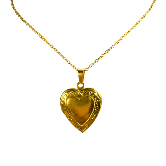 Gold heart-shaped pendant on a chain against a white background