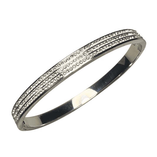 Silver bracelet with clear stones on a white background