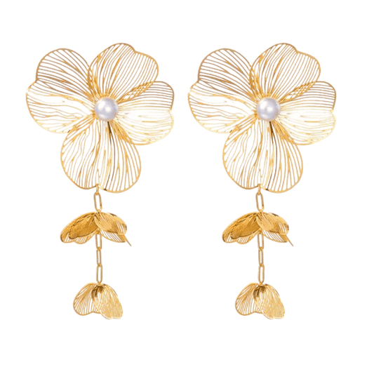 Gold flower-shaped earrings with pearl centers on a white background