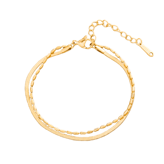 Gold bracelet on a white background
