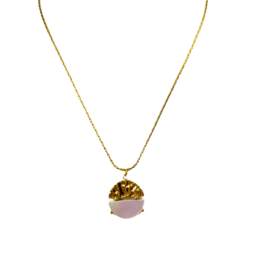 Necklace with a gold and pink pendant on a white background