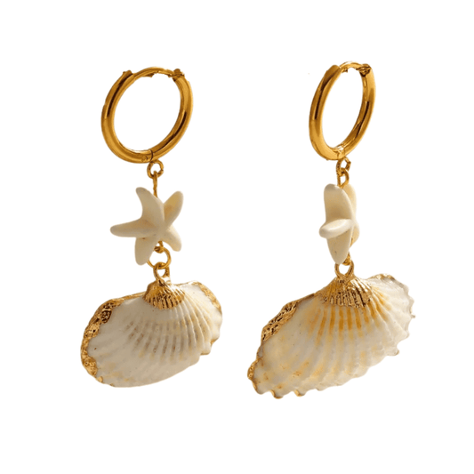 Pair of gold hoop earrings with shell and starfish charms on a white background