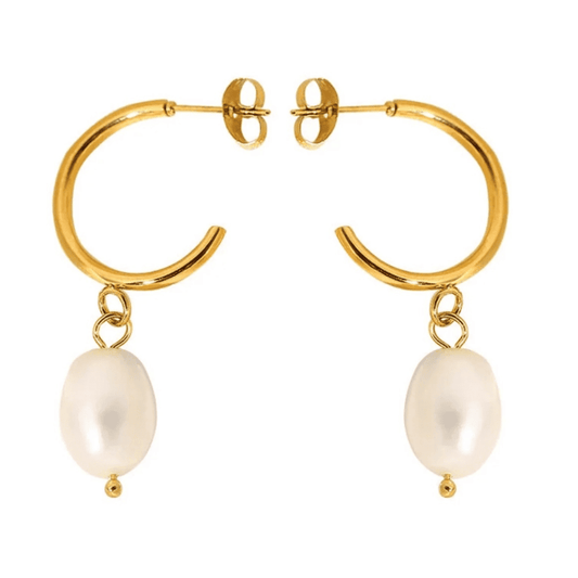 Gold hoop earrings with pearl charms on a white background