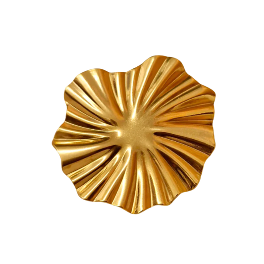 Gold decorative plate with a scalloped edge on a white background