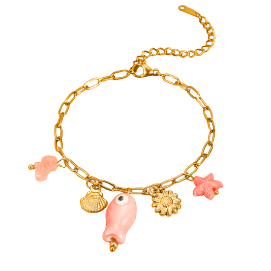 Gold bracelet with pink and gold charms on a white background