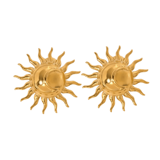 Pair of gold sun-shaped earrings on a white background