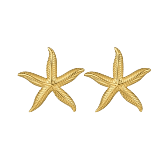 Gold starfish earrings on a white background