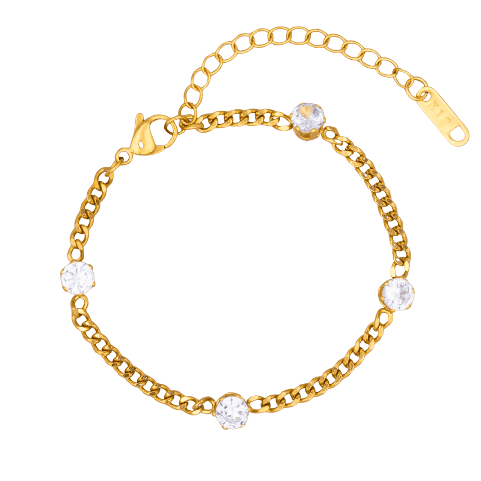 Gold bracelet with clear gemstones on a white background