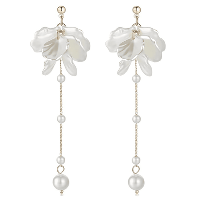Floral earrings with pearl details on a white background