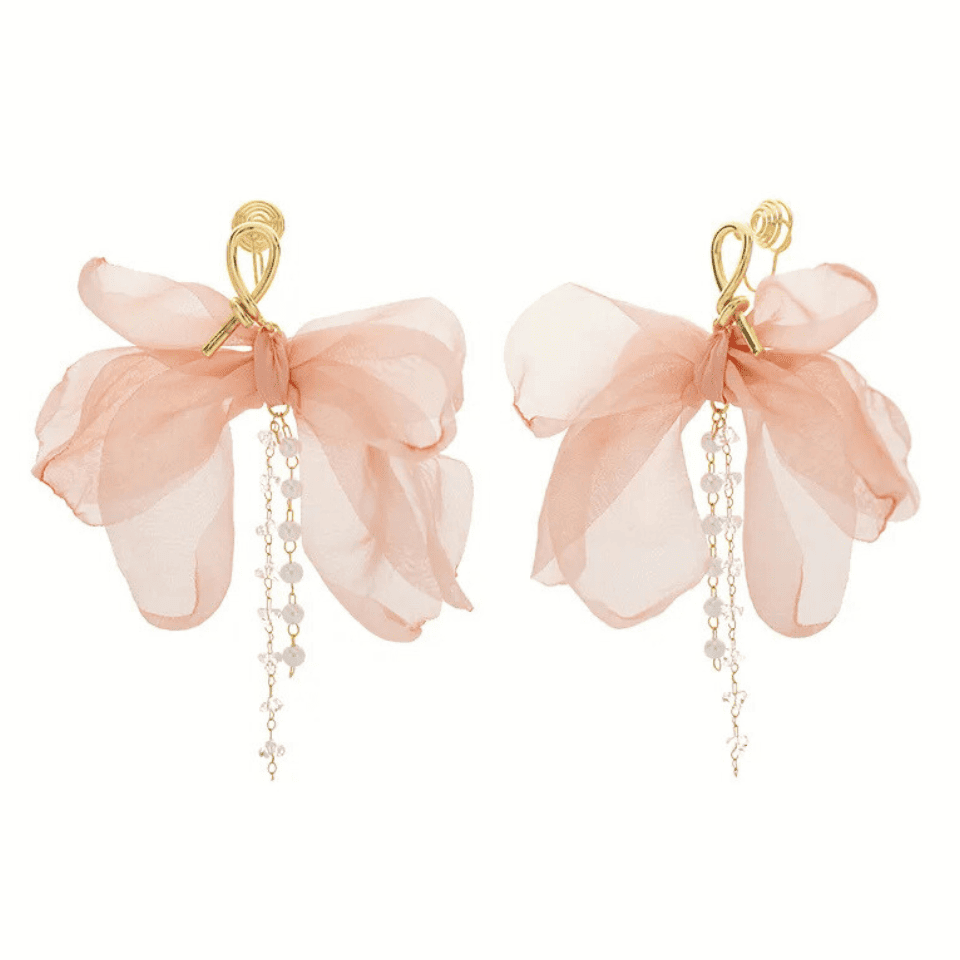 Pair of pink floral earrings with gold accents on a white background