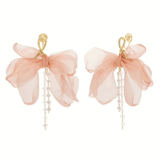 Pair of pink floral earrings with gold accents on a white background