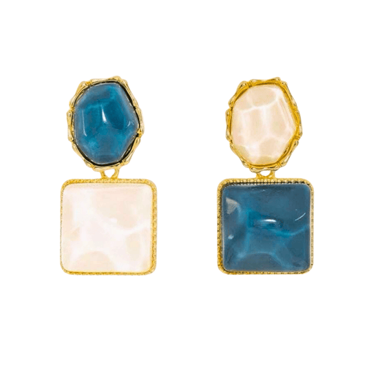 Pair of earrings with blue and beige stones on a white background