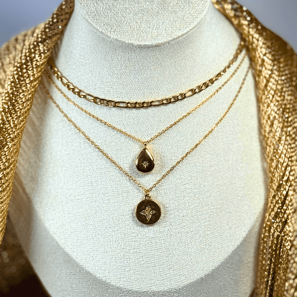 Gold necklaces with pendants on a mannequin bust