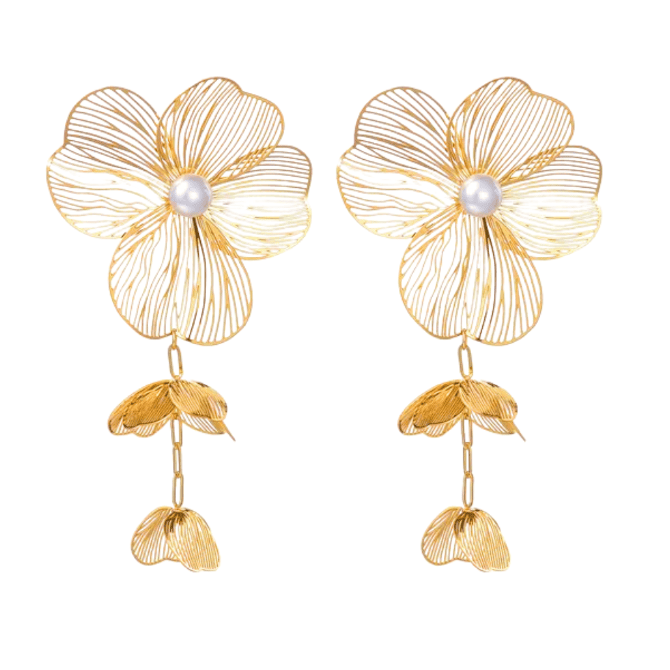 Gold flower-shaped earrings with pearl centers on a white background