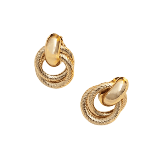 Pair of gold hoop earrings on a white background
