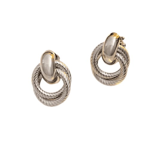 Pair of silver and gold hoop earrings on a white background