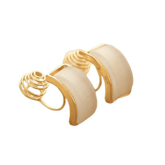 Pair of gold and beige earrings on a white background