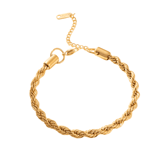 Gold braided bracelet on a white background
