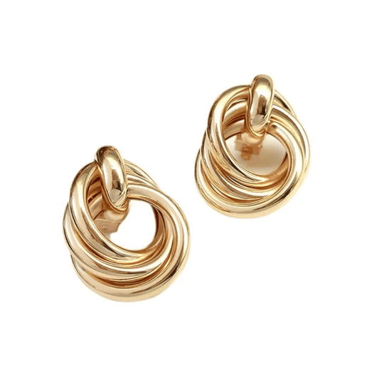 Pair of gold hoop earrings on a white background