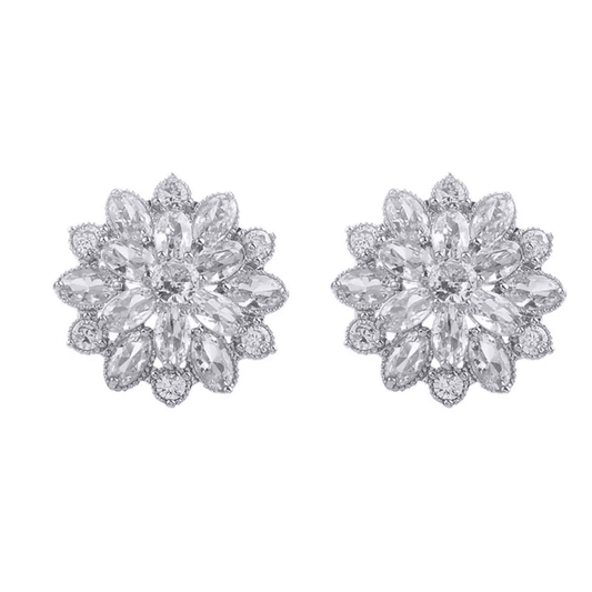 Pair of diamond flower earrings on a white background
