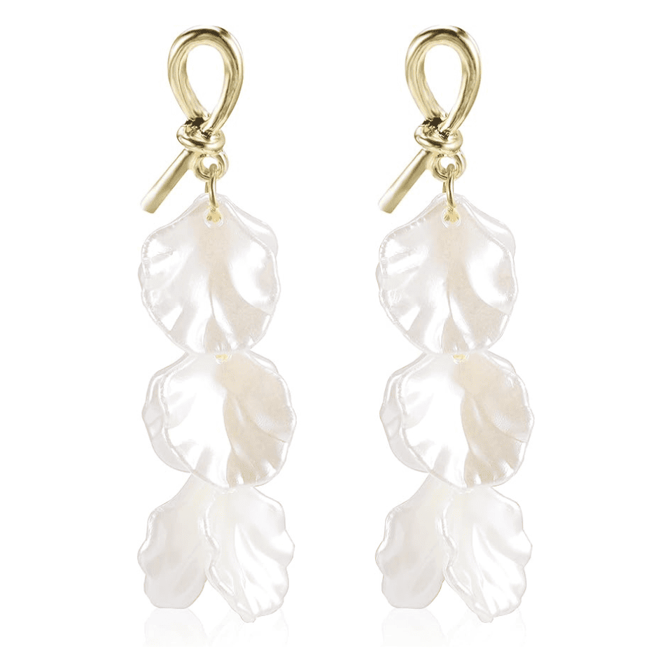Pair of pearl earrings with gold hooks on a white background