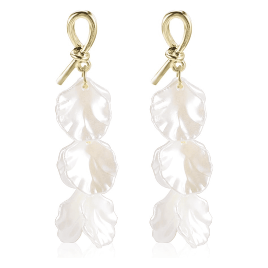 Pair of pearl earrings with gold hooks on a white background