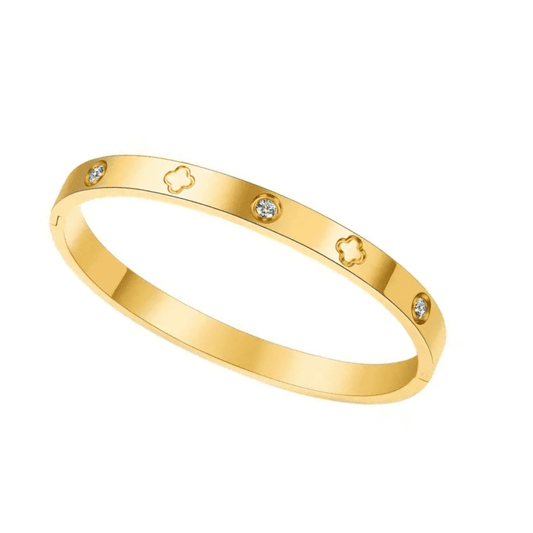 Gold bracelet with diamond accents on a white background