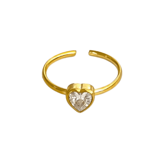 Gold ring with a heart-shaped gemstone on a white background